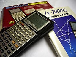 TI-84 Plus graphing calculator on Texas Instruments fx-7000G manual.