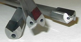 Two index drills at an angle, cutting edges facing the camera.