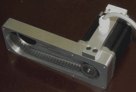 Silver metal device with rectangular shape and small circular hole.