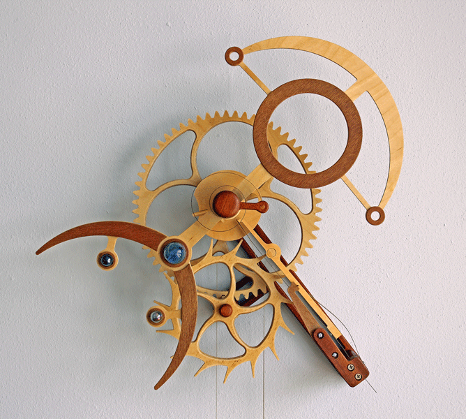Mechanical clockwork mechanism with interlocking gears and wooden/metal components.