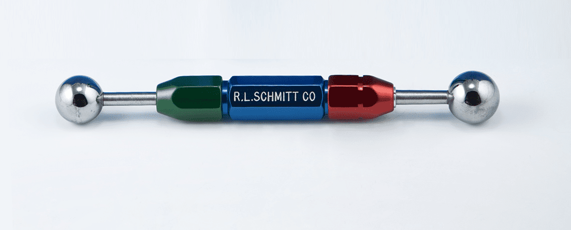 Two metal balls on a rod, color-coded green/blue and red/blue with "R.L.SCHM" label.