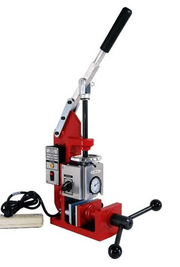 Red metal tool with lever and black handle, featuring a silver metal cylinder.