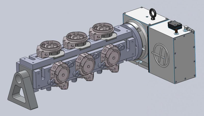 Large rectangular metal component with circular openings, handles, and attached components.