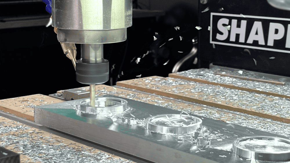 Large metal milling machine with cutting tool and shavings surrounding it.