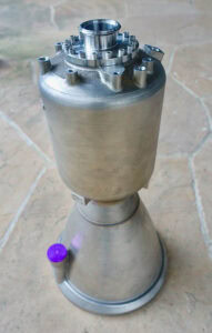 Inconel rocket engine component with complex internal structure and smooth finish.
